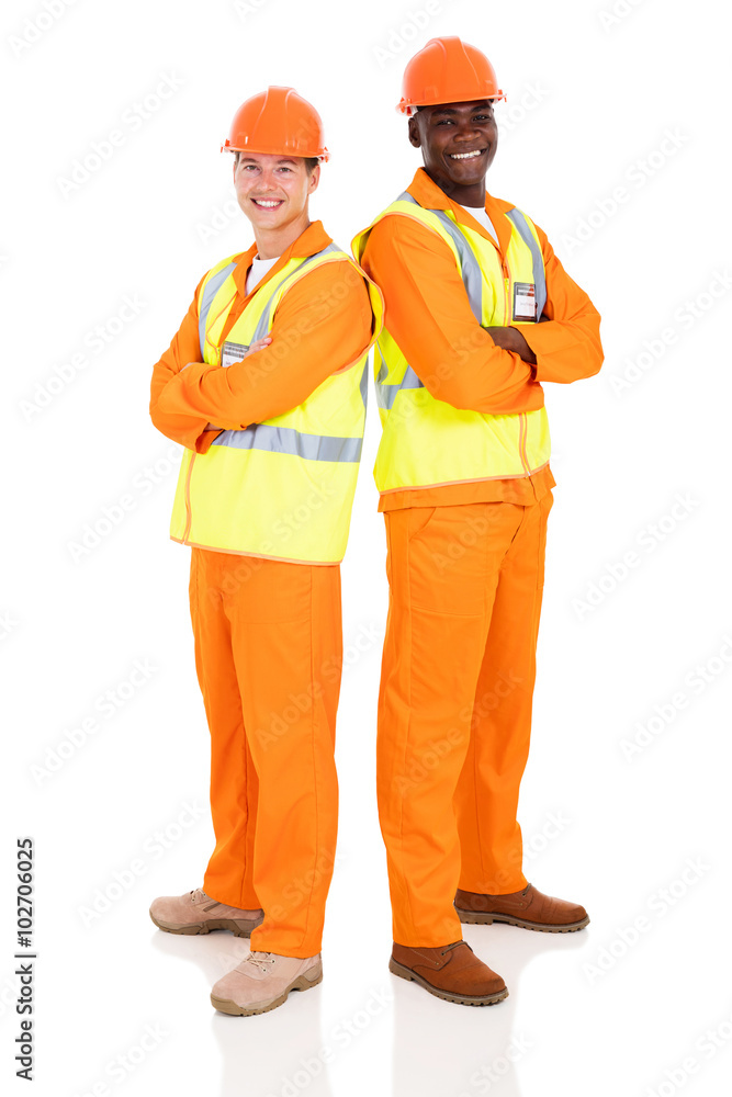 male engineers standing back to back male engineers standing back to back