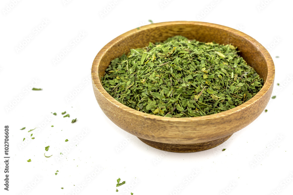 Dried Nettles in a wooden bowl Dried Nettles in a wooden bowl