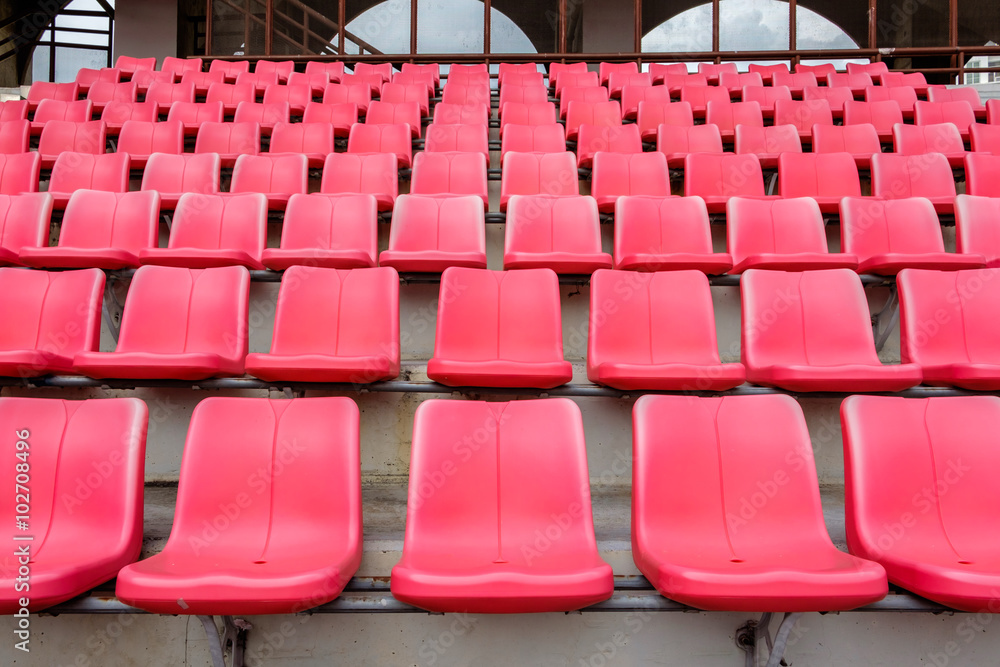 Fototapeta premium Red seats in football stadium