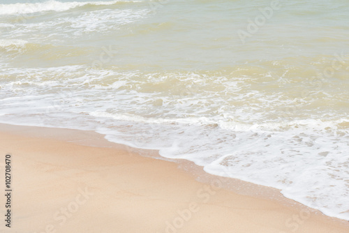 green ocean wave with white sand for background