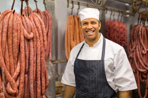 male butcher standing in butchery