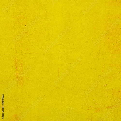 cement yellow wall with street, textured background
