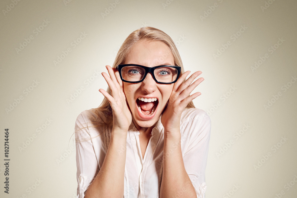 Surprised excited happy screaming woman isolated. Cheerful girl winner shocked over winning with funny joyful face expression. Model isolated on background. Surprised excited happy screaming woman isolated. Cheerful girl winner shocked over winning with funny joyful face expression. Model isolated on background.