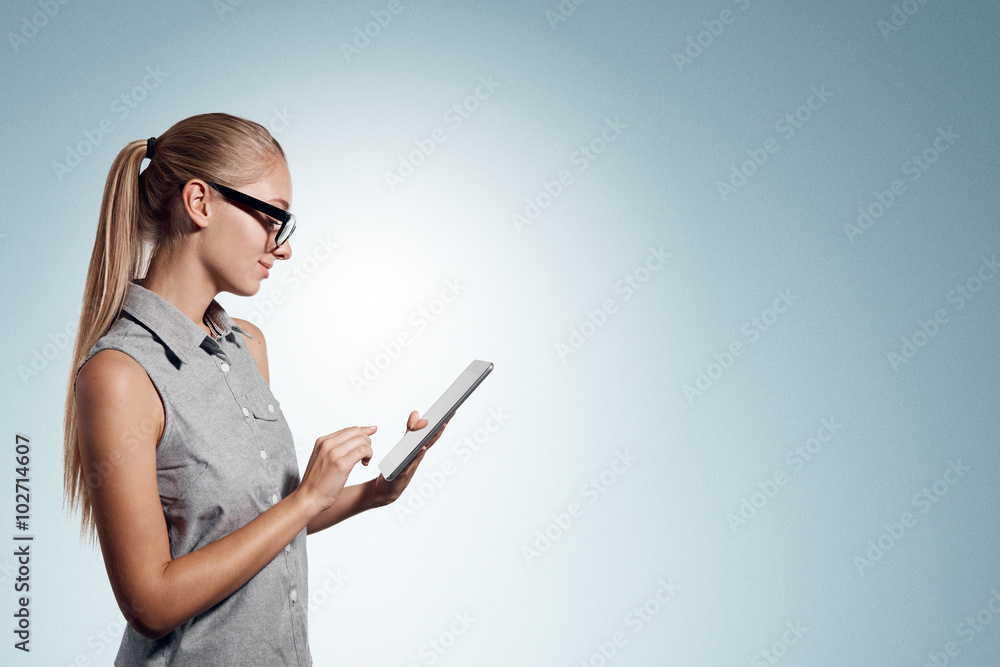 Tablet computer. Business woman using digital tablet computer PC happy isolated on white background. Beautiful woman in business shirt with finger on touch screen display. Tablet computer. Business woman using digital tablet computer PC happy isolated on white background. Beautiful woman in business shirt with finger on touch screen display.
