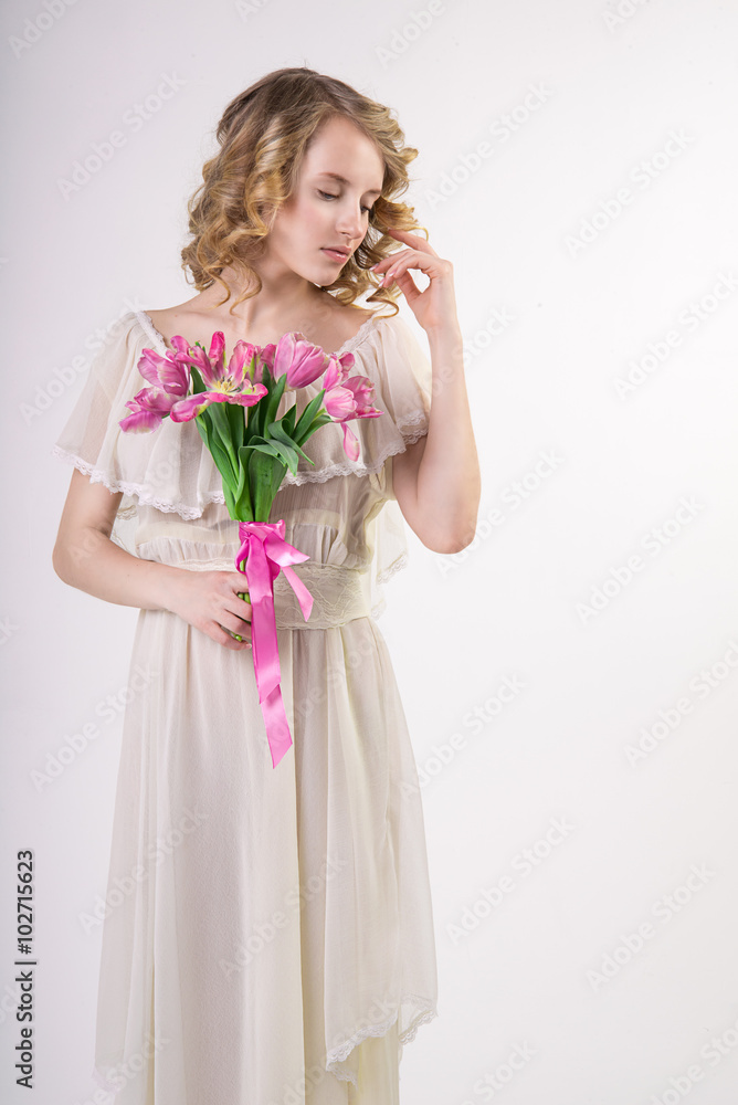 Beautiful blonde spring girl with flowers Beautiful blonde spring girl with flowers