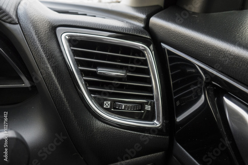Detail with the air conditioning button inside a car. © ktianngoen0128