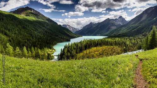 Hiking path along beautiful lake in mountain valley, Altai © EdNurg