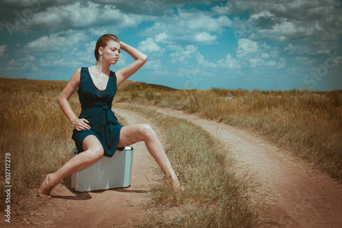 woman sit on a case nature portrait