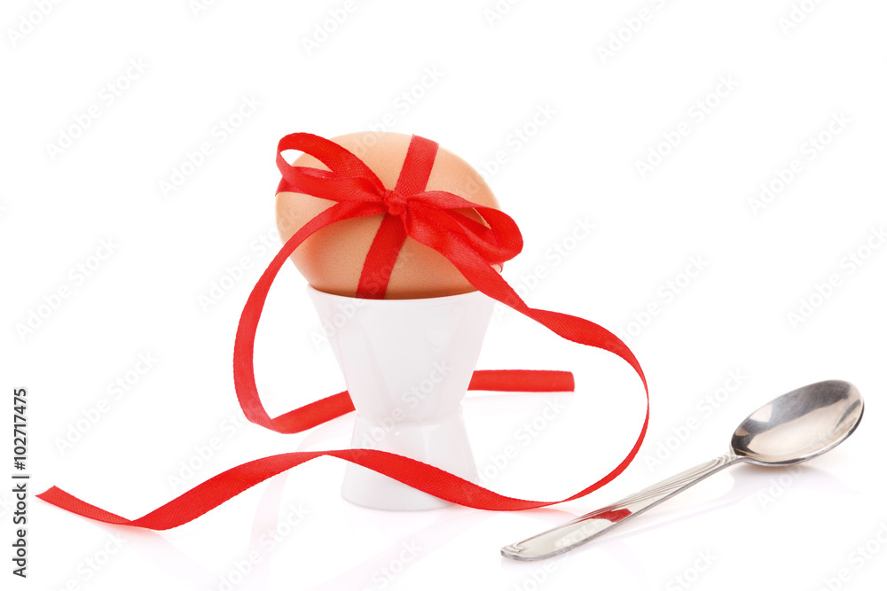 egg with red ribbon egg with red ribbon