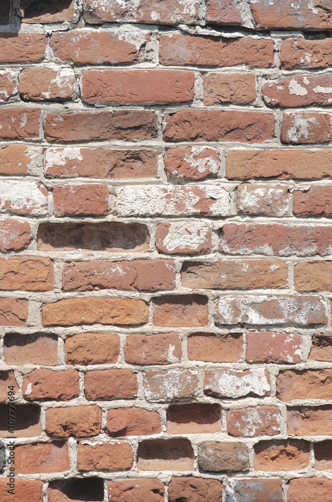 Fototapeta premium Old red cracked brick wall. Abstract background