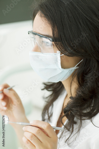 Happy female dentist working