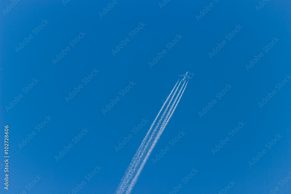 Airplane on the sky. An airplane trail across the sky Airplane on the sky. An airplane trail across the sky