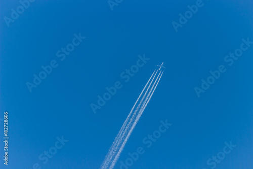 Airplane on the sky. An airplane trail across the sky