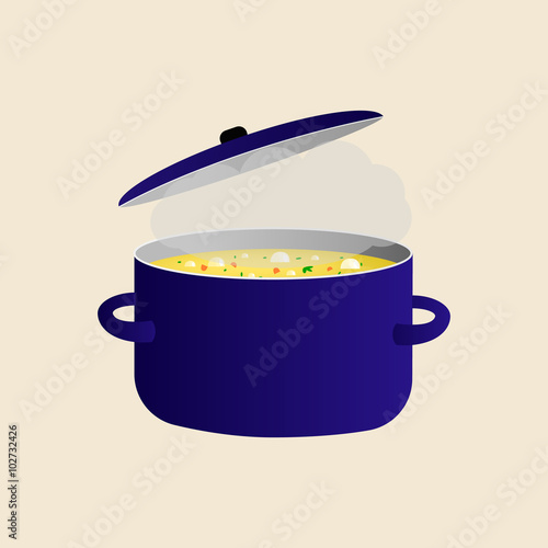 blue pot with boiling soup yellow and greens