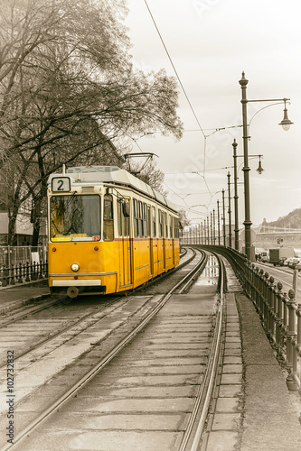 yellow tram on the embankment of Budapest