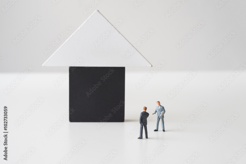 Businessman considering about to buy a house Businessman considering about to buy a house