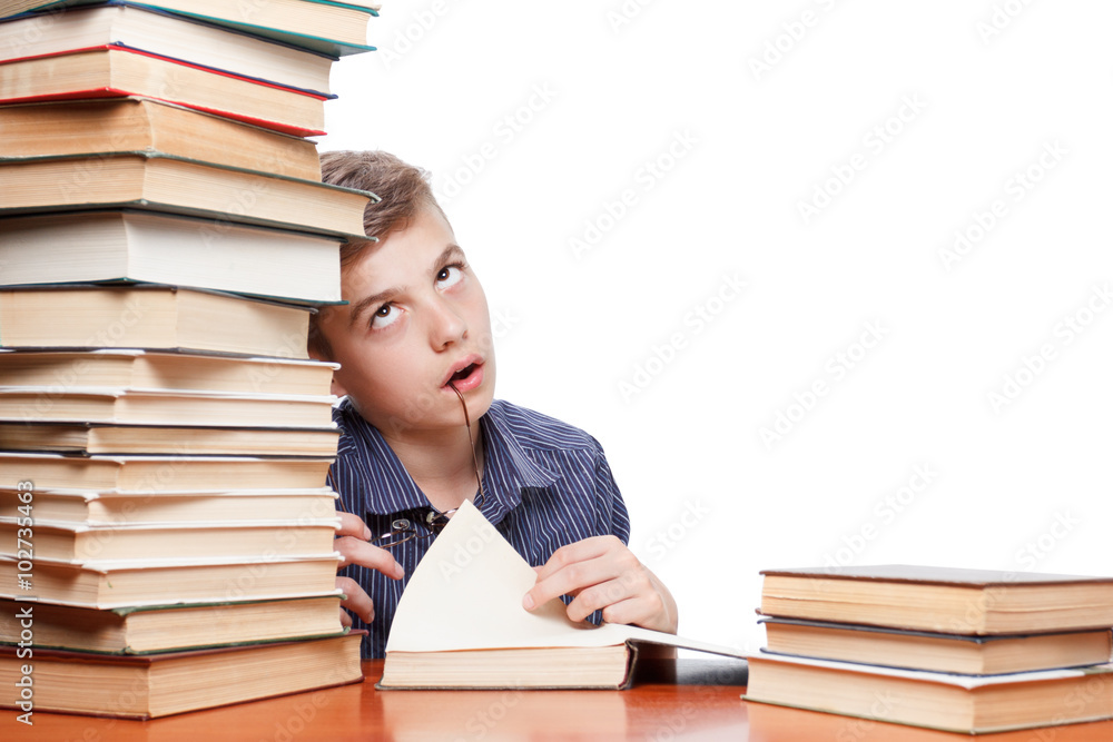 Boy is tired to read his book, isolated over white Boy is tired to read his book, isolated over white