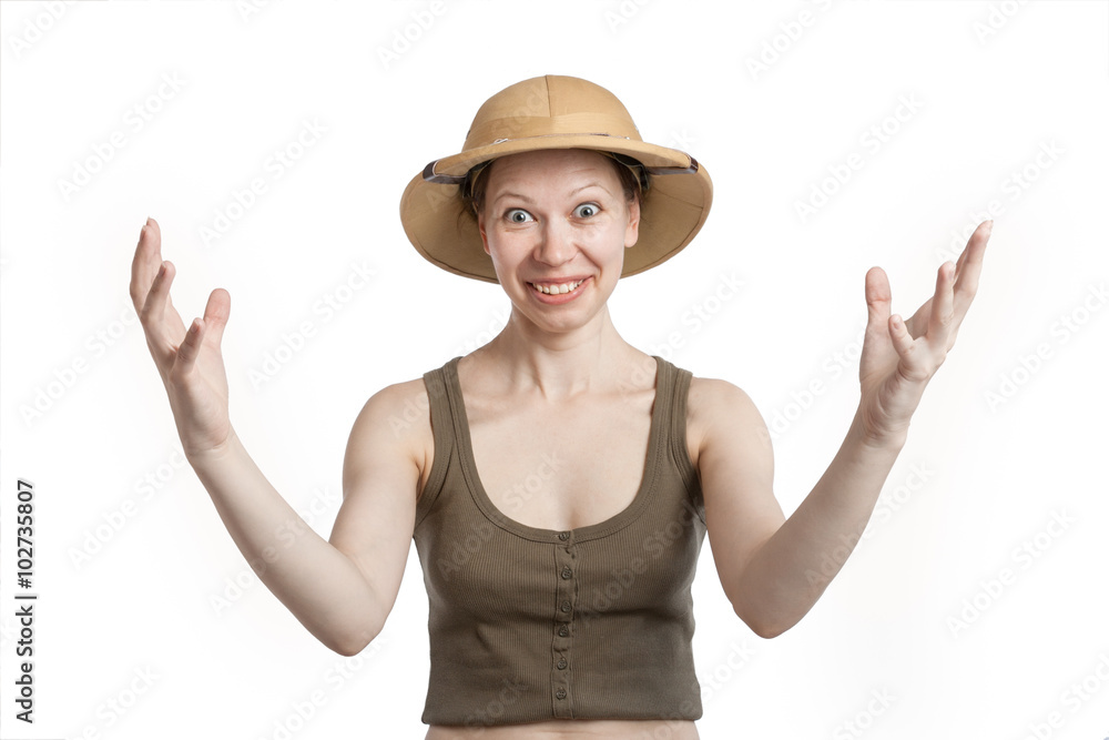 Smiling woman in a tropical helmet spreads his arms wide Smiling woman in a tropical helmet spreads his arms wide
