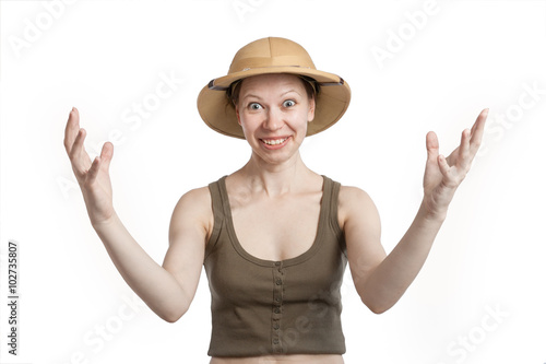 Fotografie Smiling woman in a tropical helmet spreads his arms wide