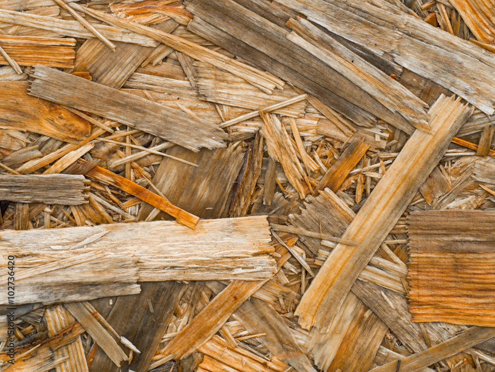 Close up of a recycled compressed wet wood chipboard. Background with space for your text Close up of a recycled compressed wet wood chipboard. Background with space for your text