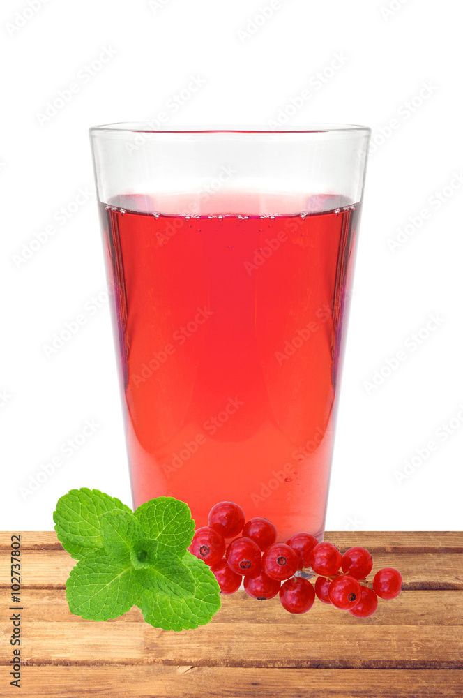 glass of juice, mint and fresh currant berries on table isolated glass of juice, mint and fresh currant berries on table isolated