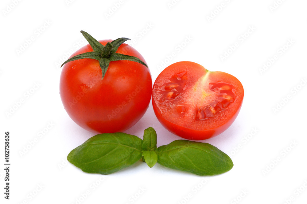 Fresh tomato with basil isolated on white background Fresh tomato with basil isolated on white background
