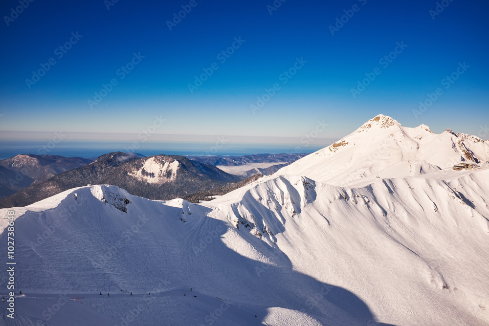Winter mountains panorama with ski slopes. Caucasus Winter mountains panorama with ski slopes. Caucasus
