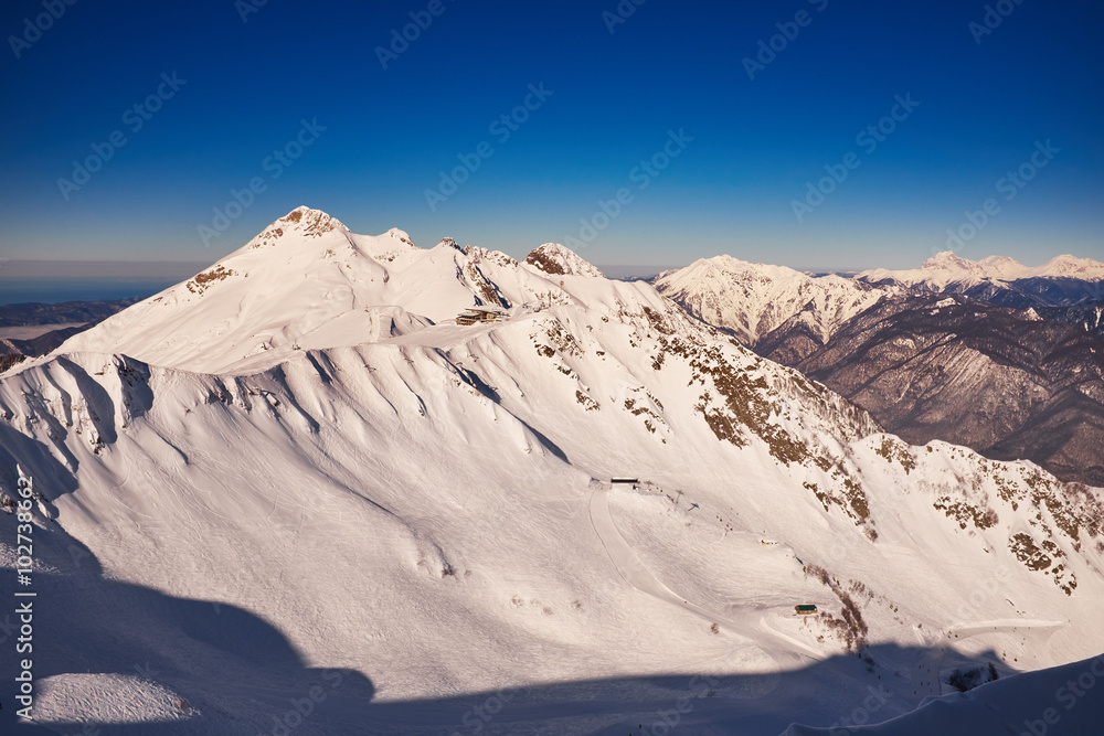 Winter mountains panorama with ski slopes. Caucasus Winter mountains panorama with ski slopes. Caucasus