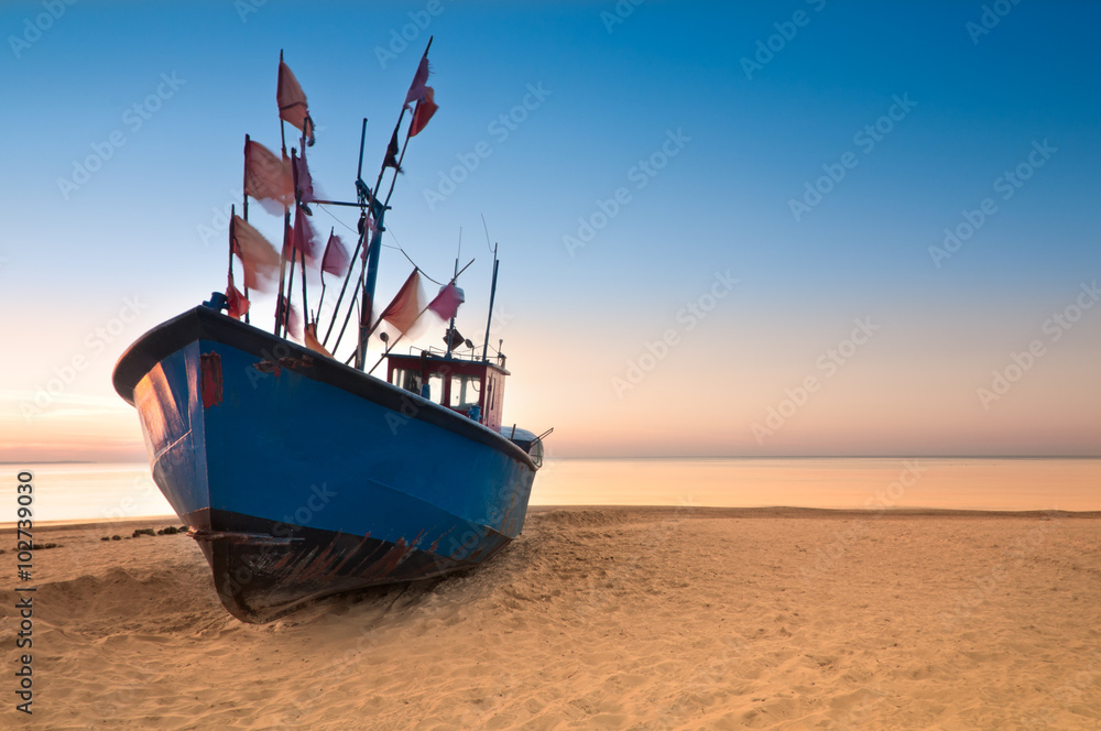 Fototapeta premium Old fishing boat on the Baltic Sea coast