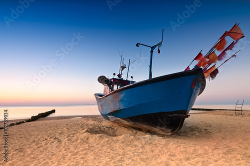 Fototapeta Naklejka Na Ścianę i Meble -  Old fishing boat on the Baltic Sea coast