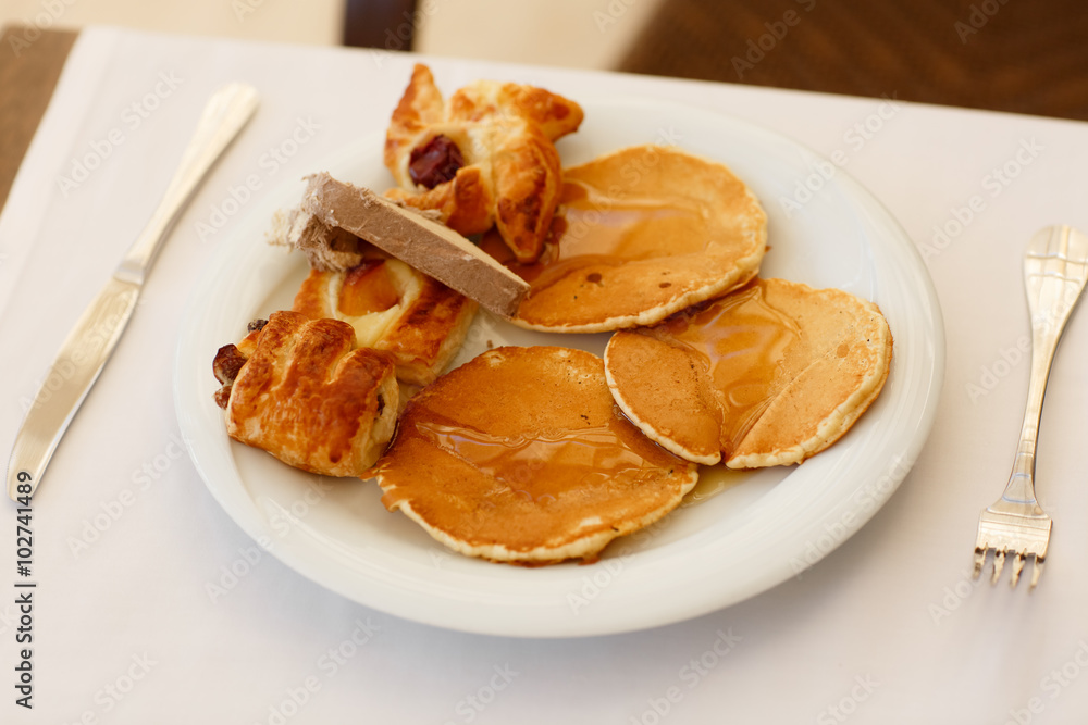 breakfast Fresh bread rolls, pancakes honey Turkish sweets, orange juice breakfast Fresh bread rolls, pancakes honey Turkish sweets, orange juice