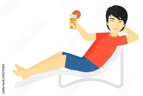 Man sitting in chaise longue.