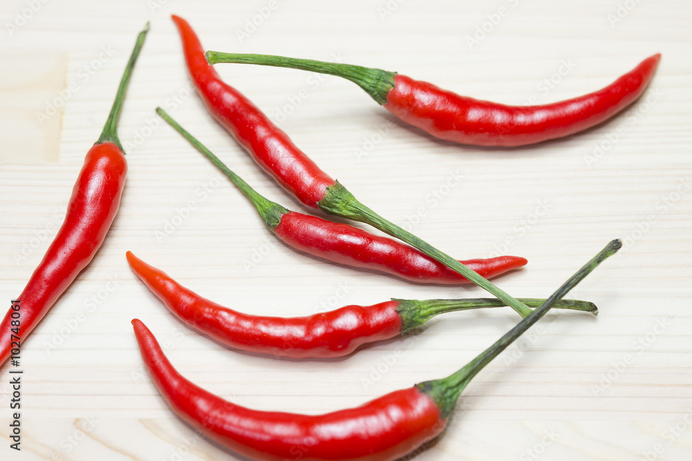 group of red chili on the wooden background
