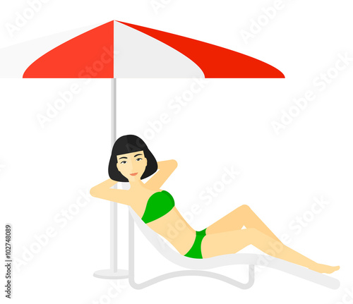 Woman sitting in chaise longue.