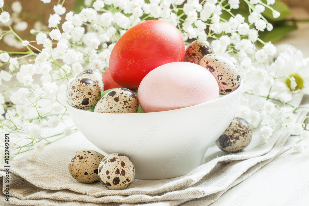 Pink easter eggs in white bowl, selective focus