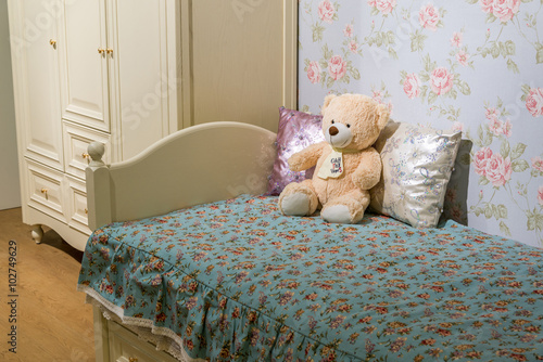 Detail of bedrooms for girls with a teddy bear