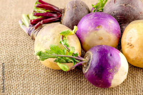 Variety of taproot vegetables including turnips, swedes and beet