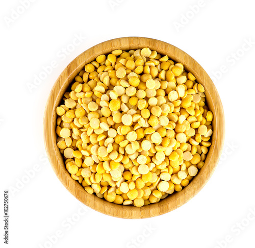Aerial view of bowl full of chana dal legumes in bowl against wh