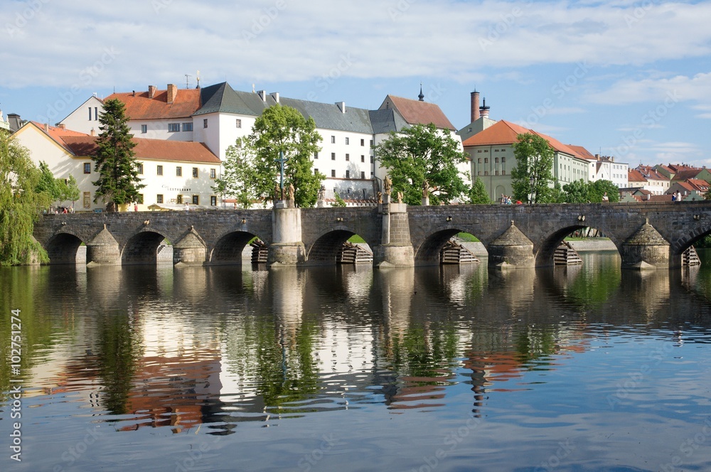 Medieval Town Pisek and historic stone bridge over river Otava in the Southern Bohemia, Czech Republic Medieval Town Pisek and historic stone bridge over river Otava in the Southern Bohemia, Czech Republic