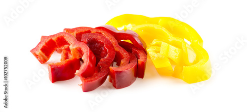 Close up of long strips of red capsicum and yellow bell pepper o