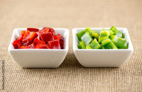 Wallpaper Mural Organic raw red and green capsicum in bowls