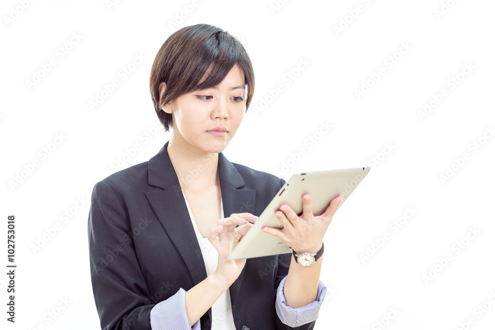 Asian businesswoman working on tablet computer Asian businesswoman working on tablet computer