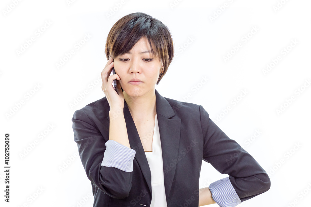 Annoyed Asian businesswoman on cell phone Annoyed Asian businesswoman on cell phone