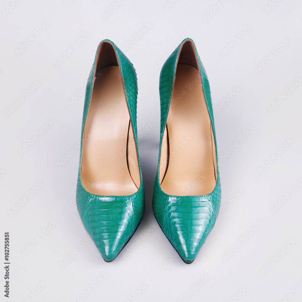 Green high heel women shoes on white background. Green high heel women shoes on white background.