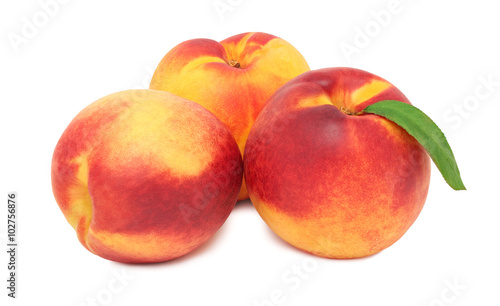 Three whole ripe nectarines (isolated)