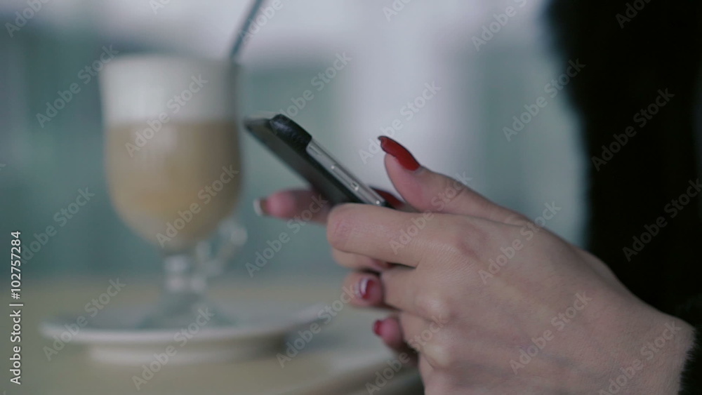 Close up of smartphone in the soft woman's hands Close up of smartphone in the soft woman's hands