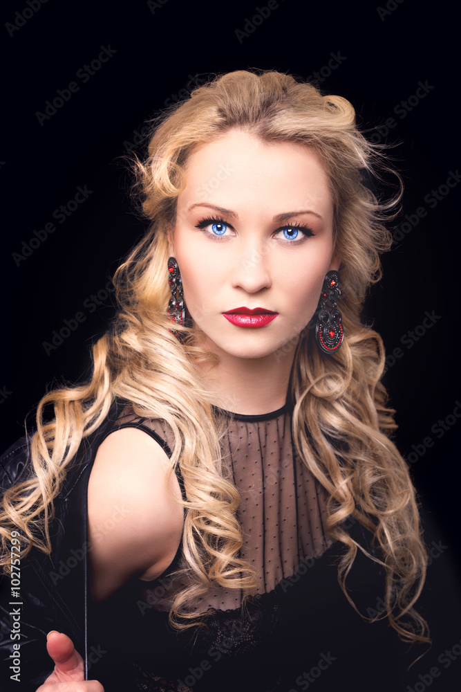 Beautiful fashion model girl with blond hair. Portrait of glamour woman with bright makeup isolated on black background. Beautiful fashion model girl with blond hair. Portrait of glamour woman with bright makeup isolated on black background.