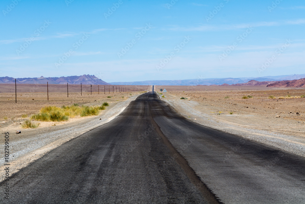 grey tared road in namibia, africa