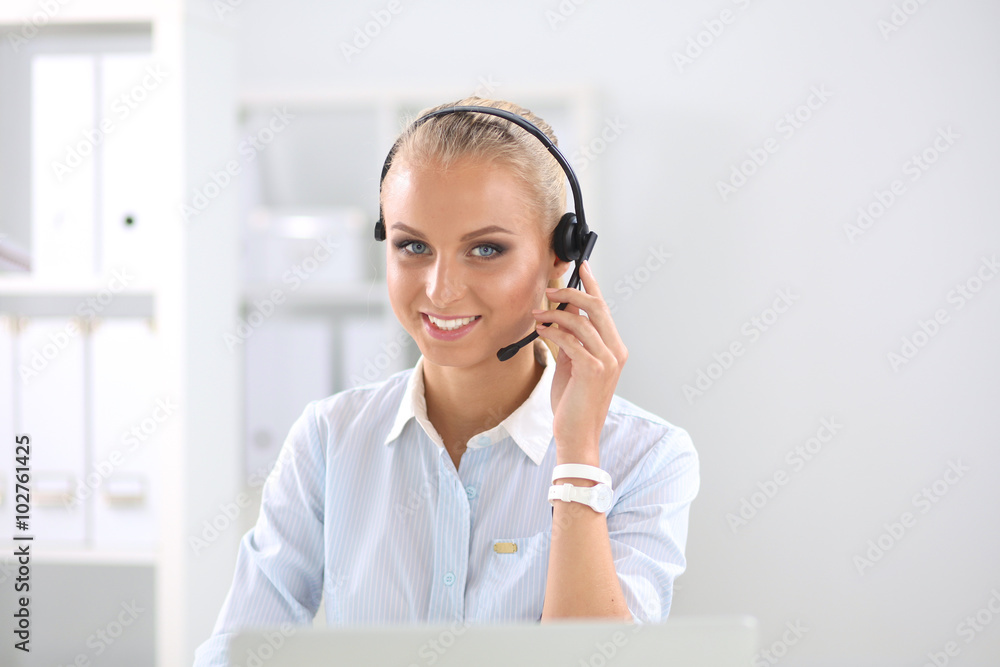 Close-up portrait of a customer service agent sitting at office Close-up portrait of a customer service agent sitting at office