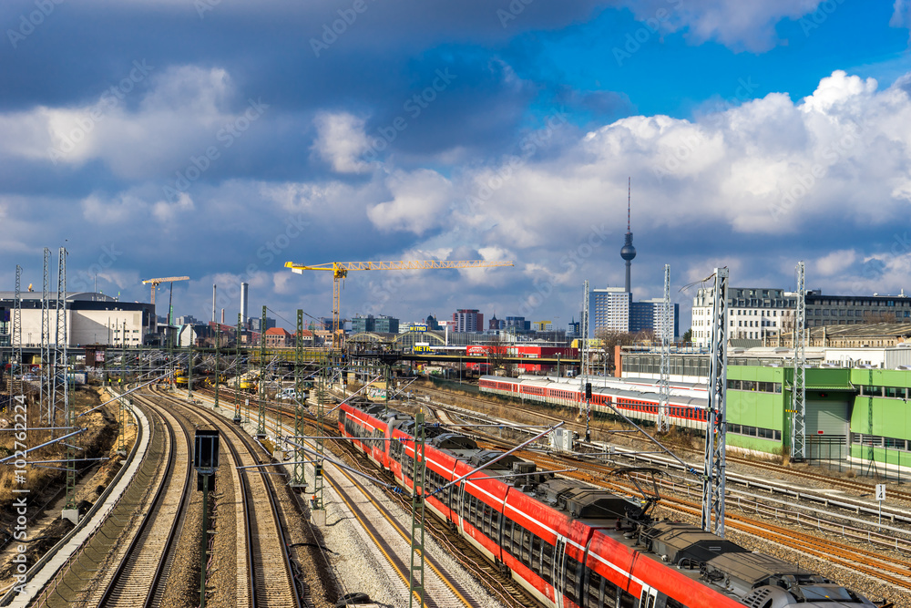 Railway tracks going through the city center of Berlin, with cityscape in the background